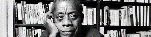 James Baldwin in a library