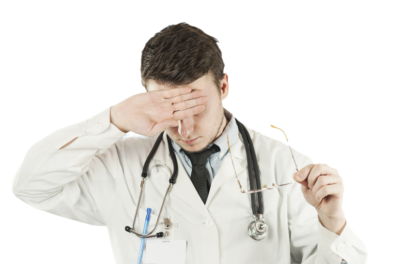 Doctor wiping forehead in relief